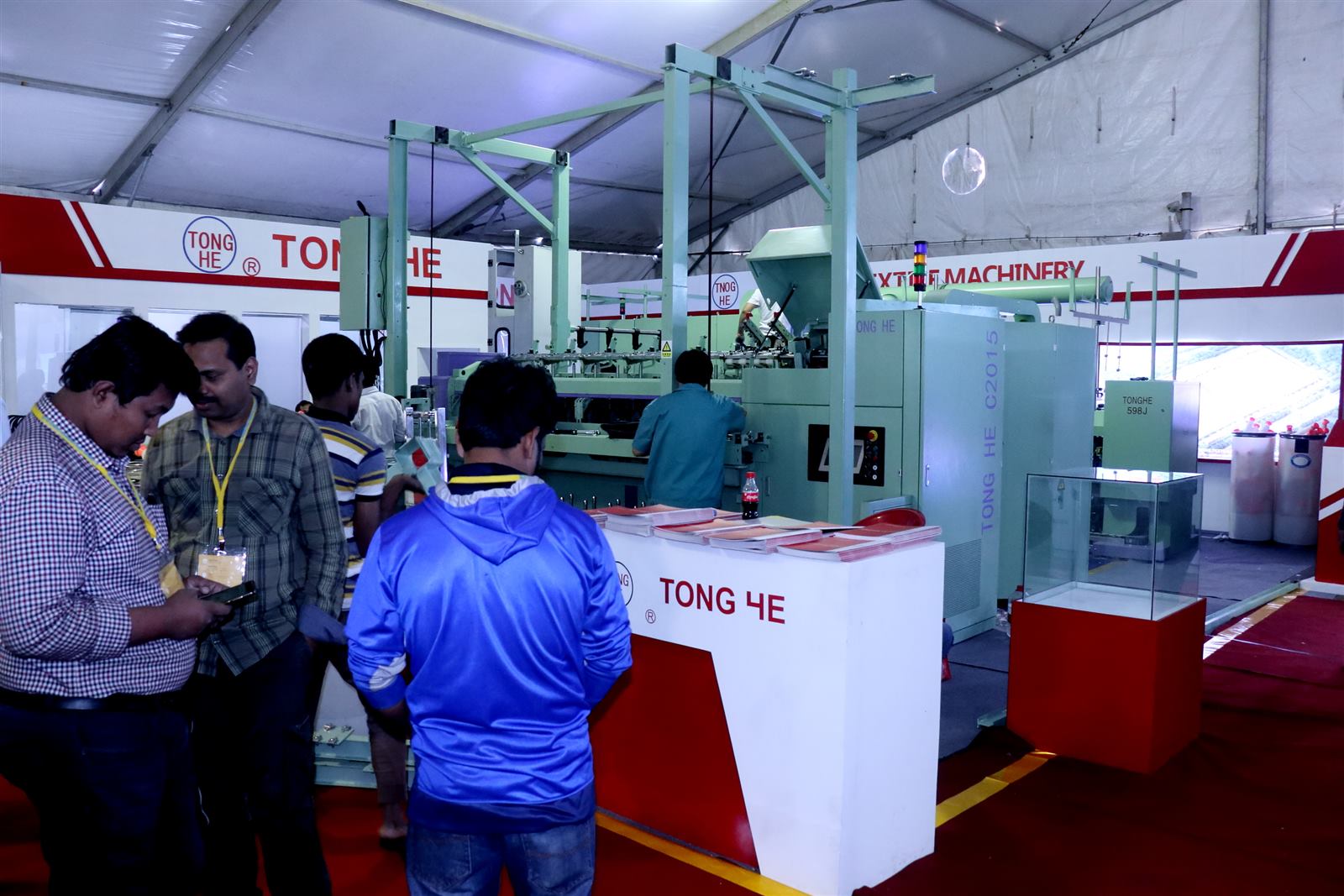 TONG HE textile machinery exhibition stand with live machinery demonstration